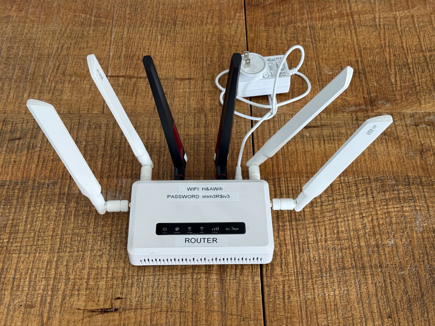 Router with all six antennas and the Wi-Fi password label